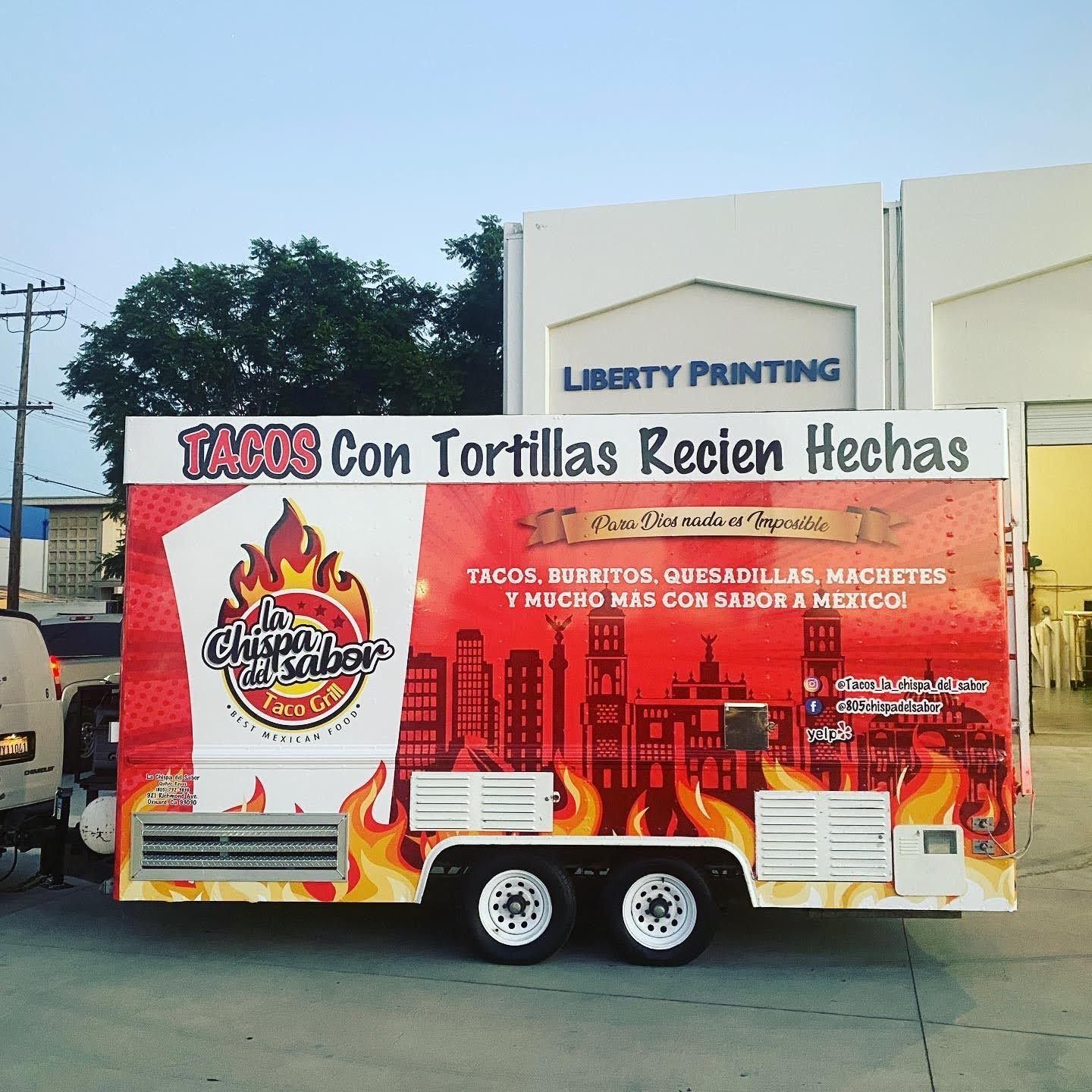 A food truck that says tacos con tortillas recien hechas