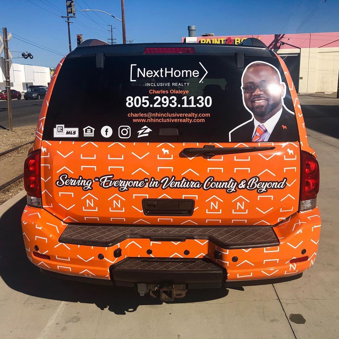 A next home van is parked on the side of the road