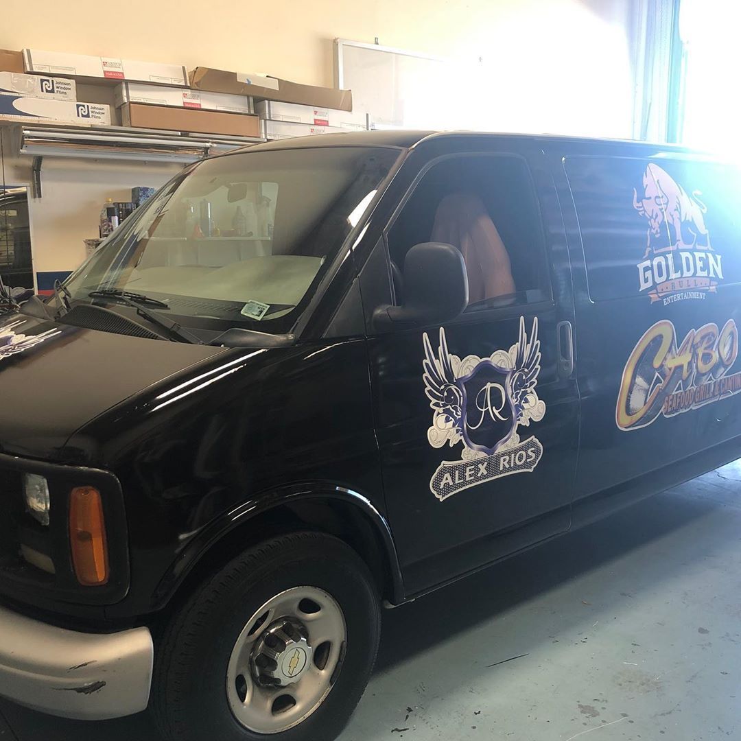A black van with the word golden on the side