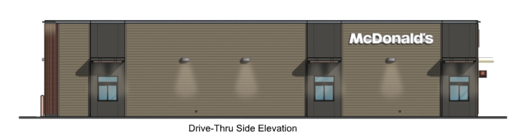 Drive-thru side elevation of a McDonald's restaurant with dark grey accents, windows, and the McDonald's logo.