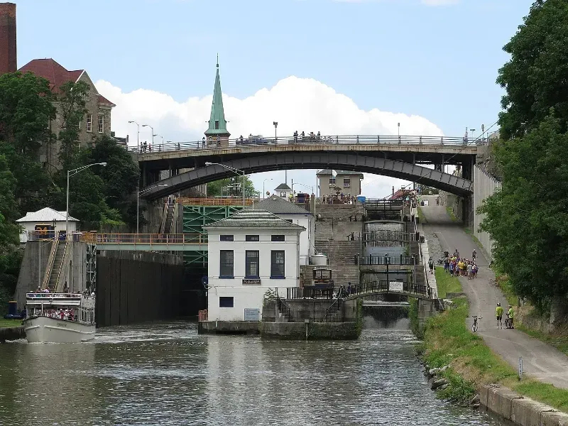 A bridge over a river with a building in the foreground
