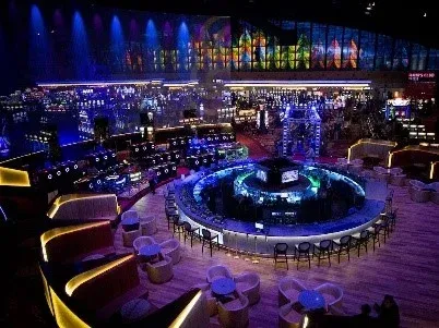 An aerial view of a casino with tables and chairs