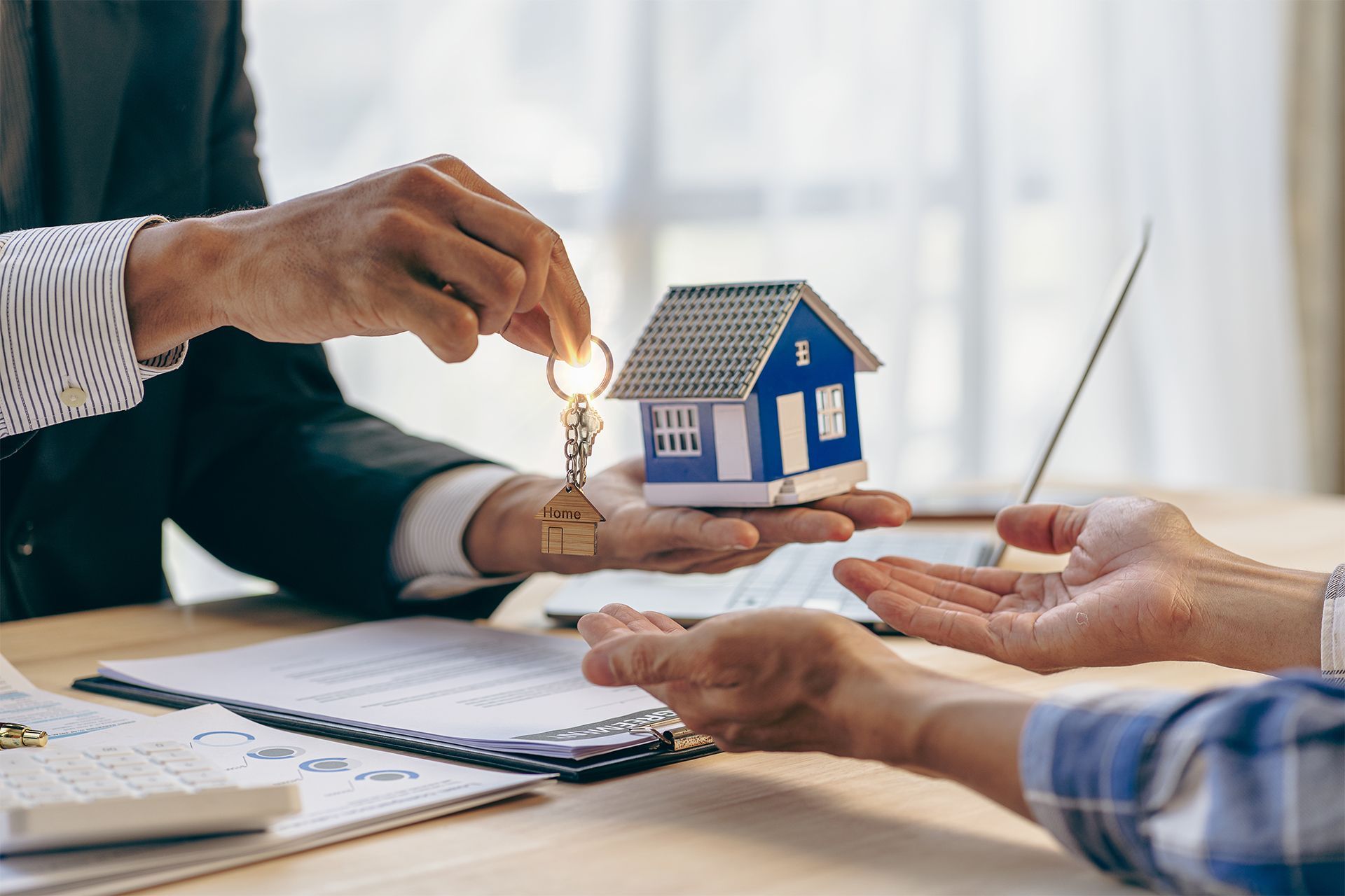 Handing Out House Model and Key