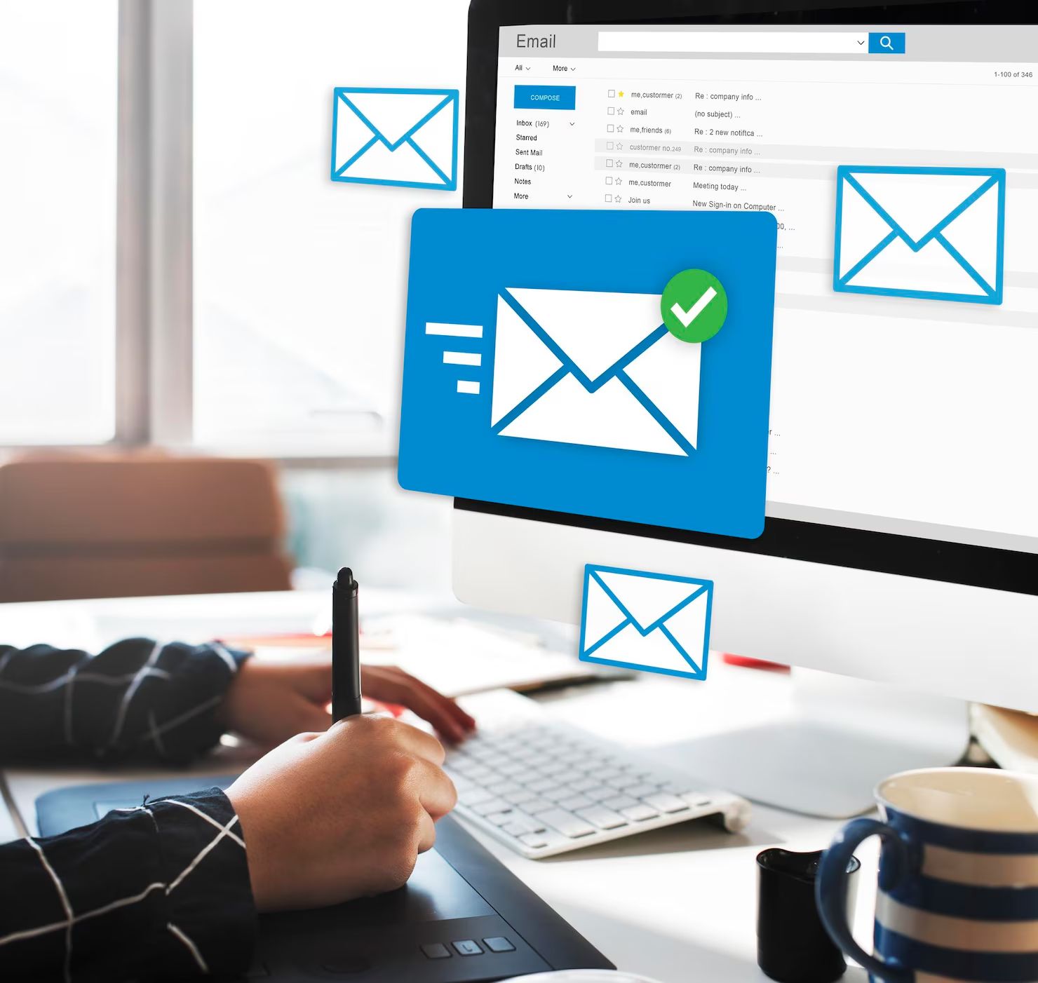 Person using computer, sending email. Envelopes float around a screen.
