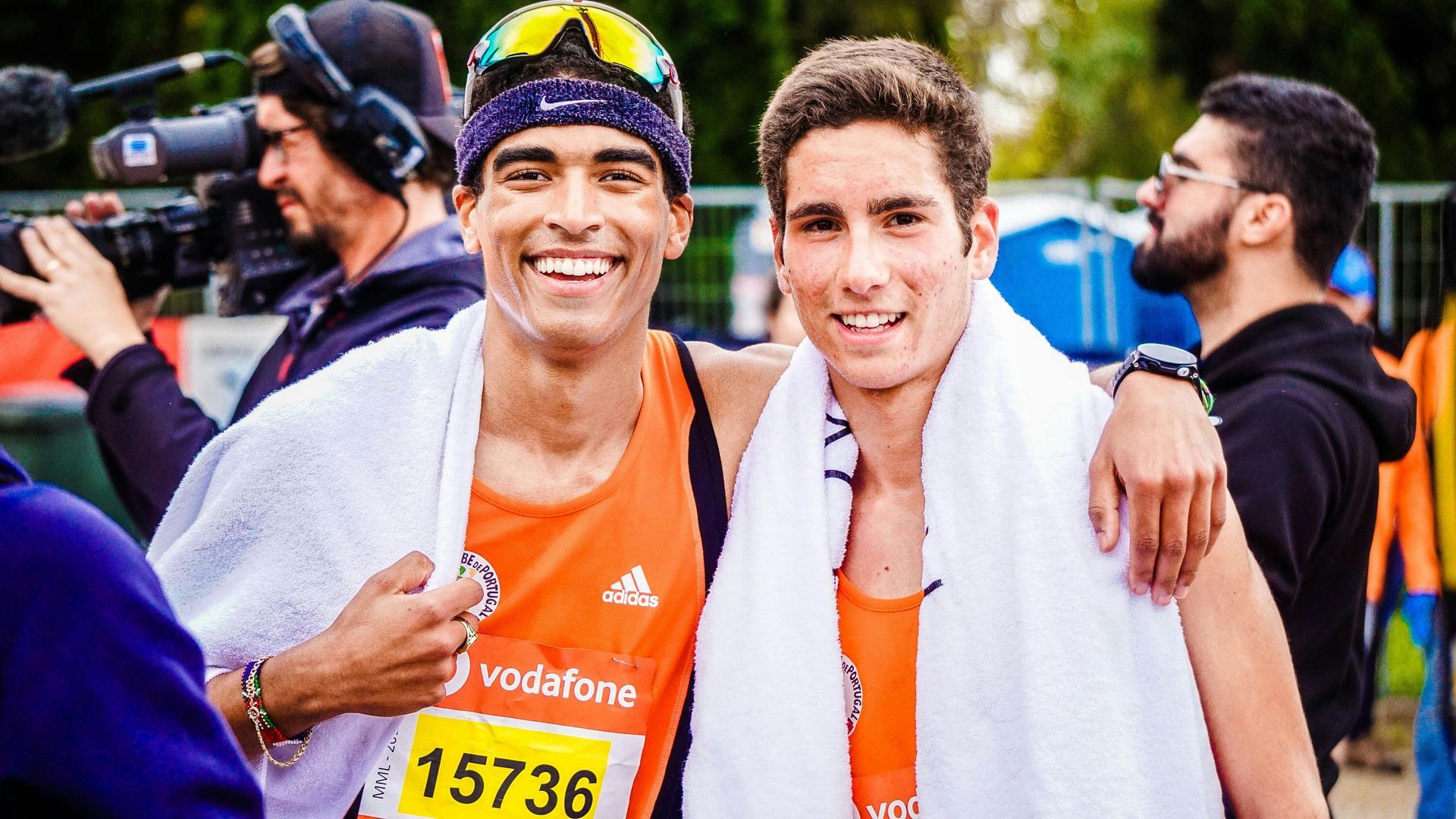Two athletes posing at the end of a race