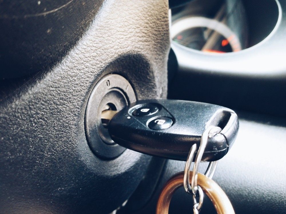 A Close Up of a Car Key in the Ignition — Suresafe Locksmiths in Glenvale, QLD