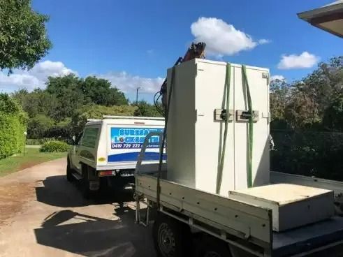 A Truck is Carrying a Safe on the Back of It — Suresafe Locksmiths in Glenvale, QLD