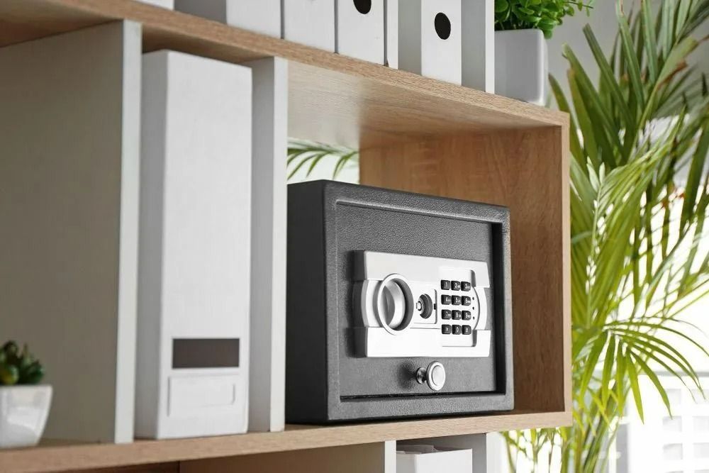 A Safe is Sitting on Top of a Wooden Shelf — Suresafe Locksmiths in Glenvale, QLD