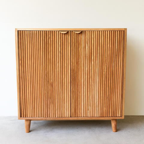 Wooden nesting tables, light brown finish, stacked, showing wood grain details.