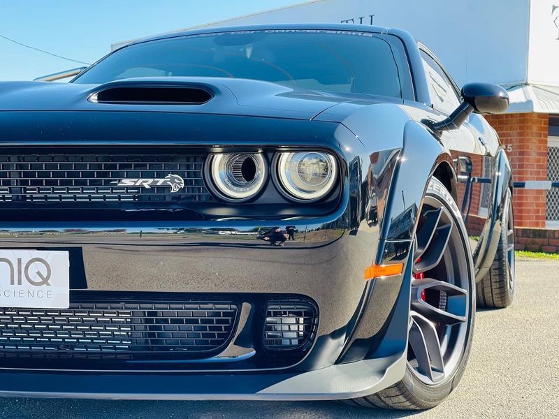 Blue Dodge Challenger Parked Outdoors in Front View — Jake's Car Detailing in Taminda, NSW