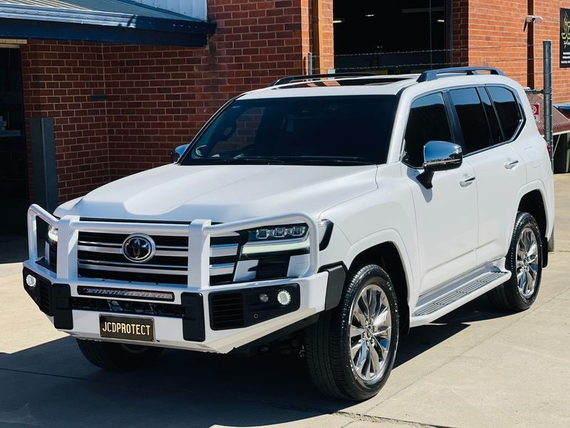 White Toyota SUV Parked Outside a Brick Building — Jake's Car Detailing in Taminda, NSW