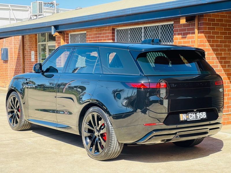 Black SUV Parked Beside a Brick Building in Bright Daylight — Jake's Car Detailing in Taminda, NSW