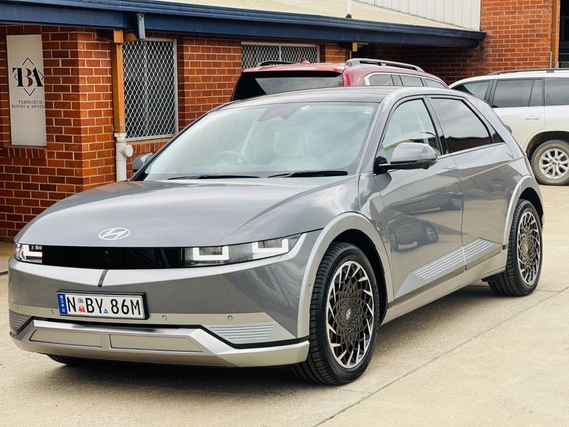 Grey Hyundai Electric SUV Parked Outside a Building — Jake's Car Detailing in Taminda, NSW