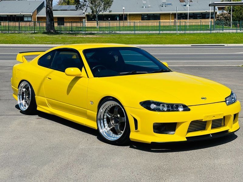Yellow Sports Car Parked on a Road, With a Low Front Bumper and Shiny Chrome Wheels — Jake's Car Detailing in Taminda, NSW