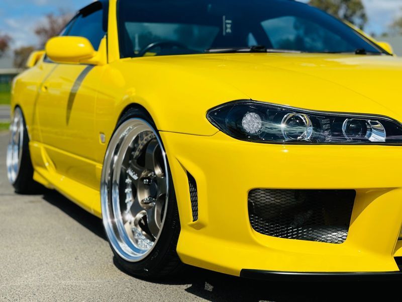 Bright Yellow Sports Coupe Parked Outdoors — Jake's Car Detailing in Taminda, NSW