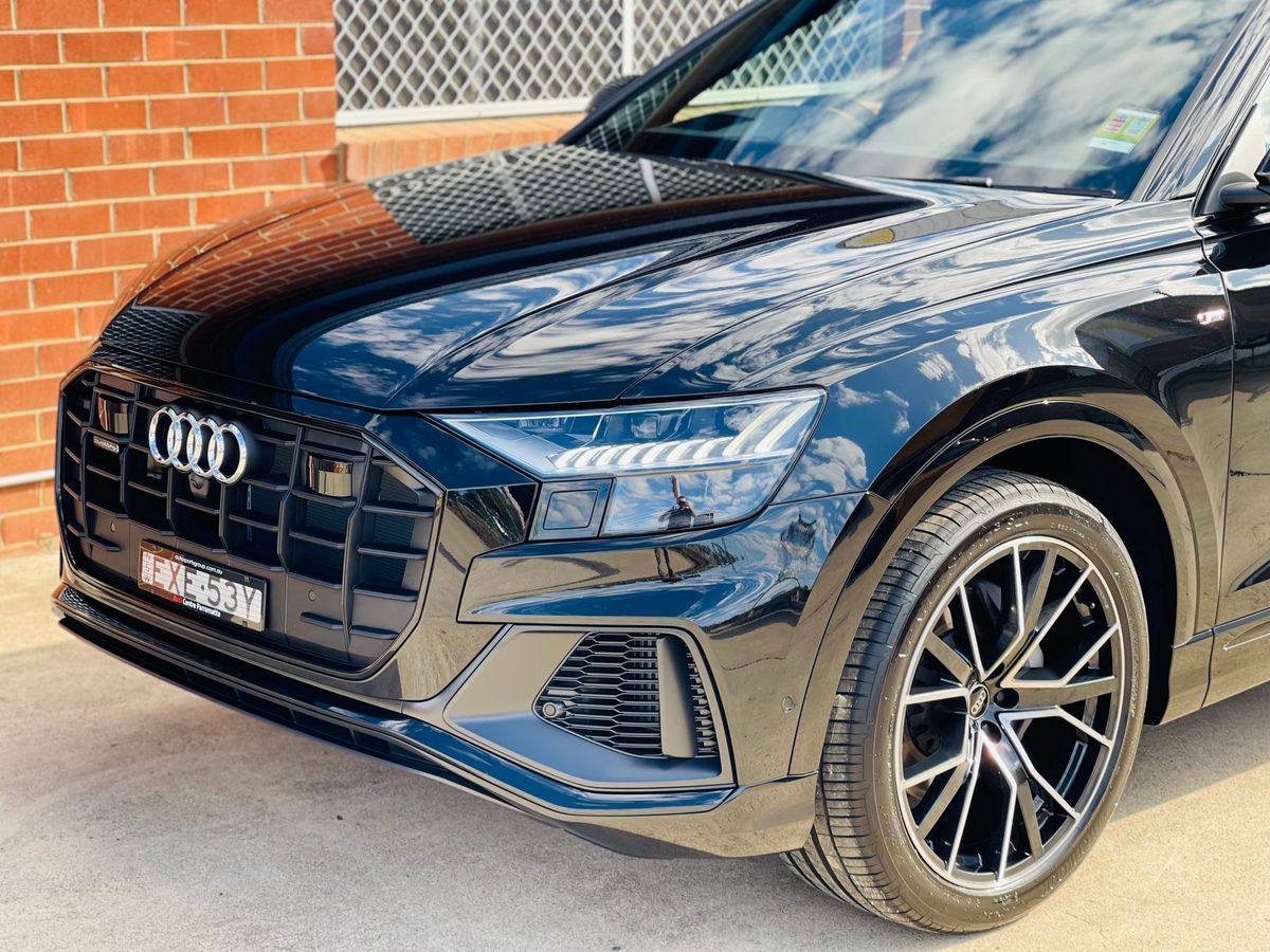Black Car Parked by a Brick Wall, Front-left View — Jake's Car Detailing in Taminda, NSW