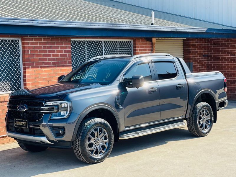 Grey Pickup Truck Parked Beside a Brick Building in Daylight — Jake's Car Detailing in Taminda, NSW
