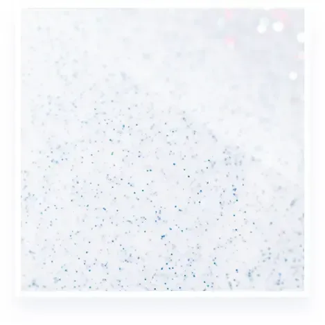White background with scattered tiny blue speckles and faint pastel dots