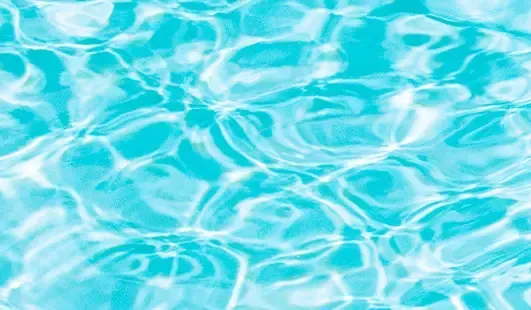 Rippling turquoise pool water with bright sunlight reflections