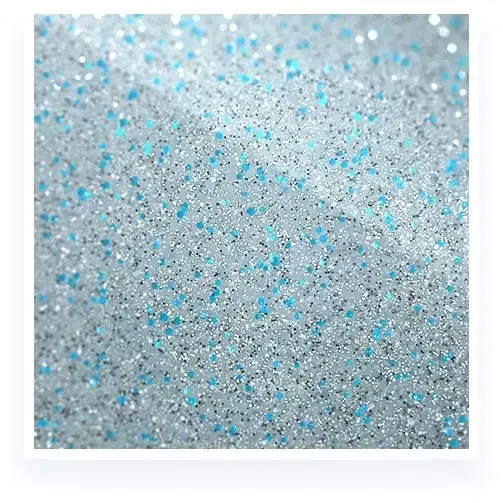 Close-up of fine silver glitter with scattered light blue sparkles
