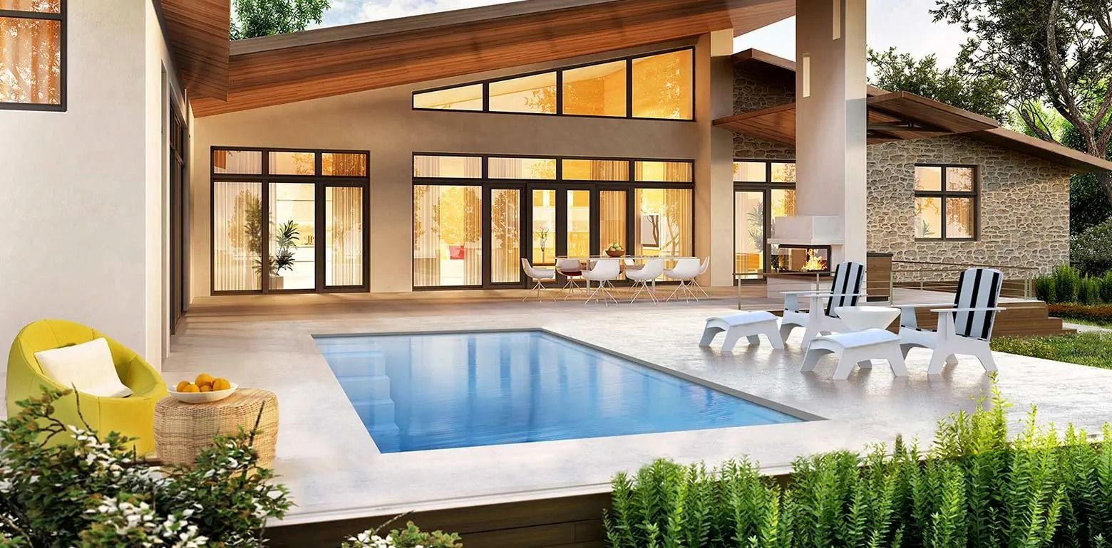 Modern luxury home patio with a swimming pool, lounge chairs, and warm evening light