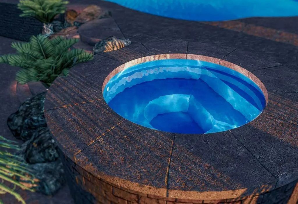Circular stone hot tub glowing blue beside a pool at dusk