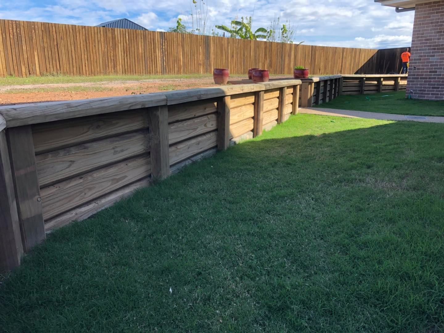 House With a Fence and a Carport in Front of It — Lange's Fencing & Landscaping Centre in Maryborough, QLD