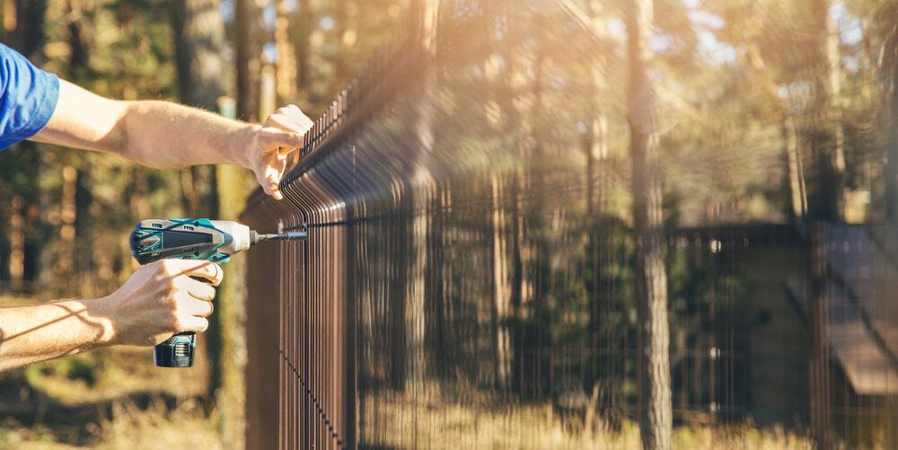 Fencing Supplies With a Drill — Lange's Fencing & Landscaping Centre in Island Plantation, QLD