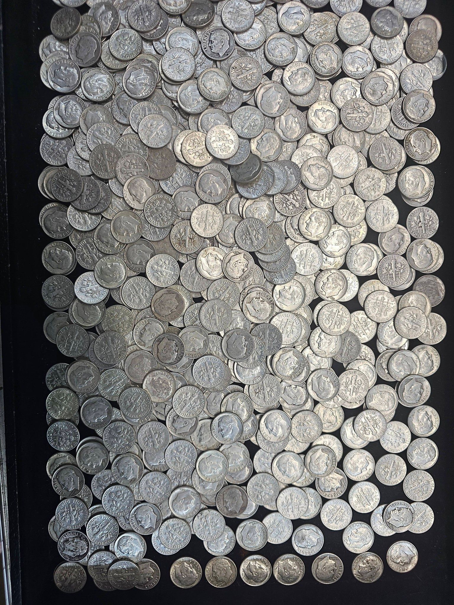 Close-up of a textured surface made of many small gray circular discs arranged in a tight grid.