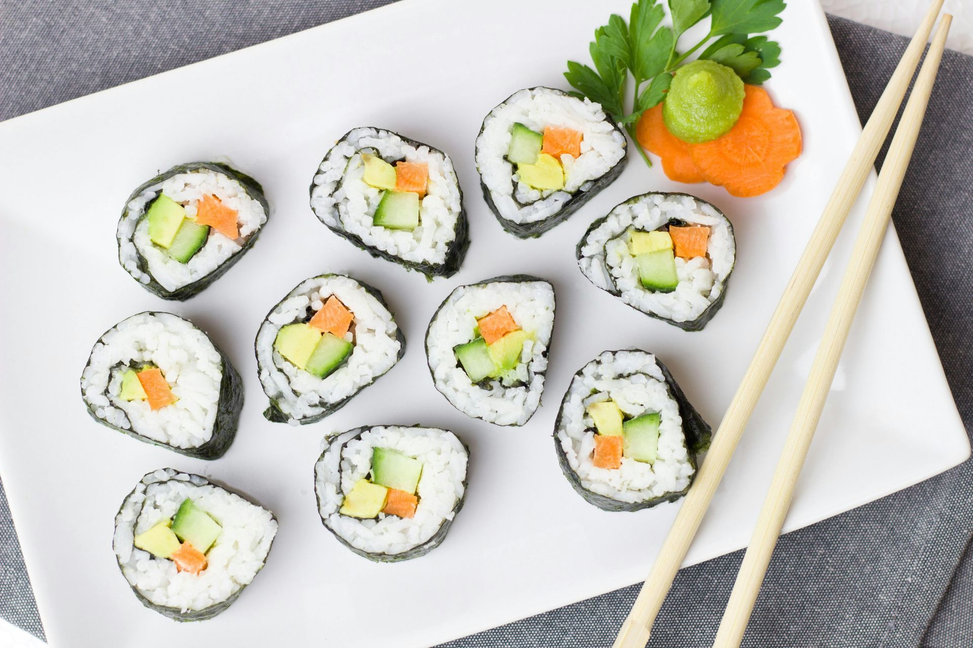 White rectangular plate of sushi.