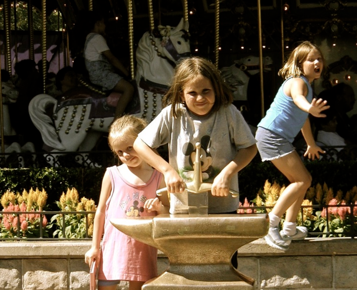 Kids pulling a sword from a stone