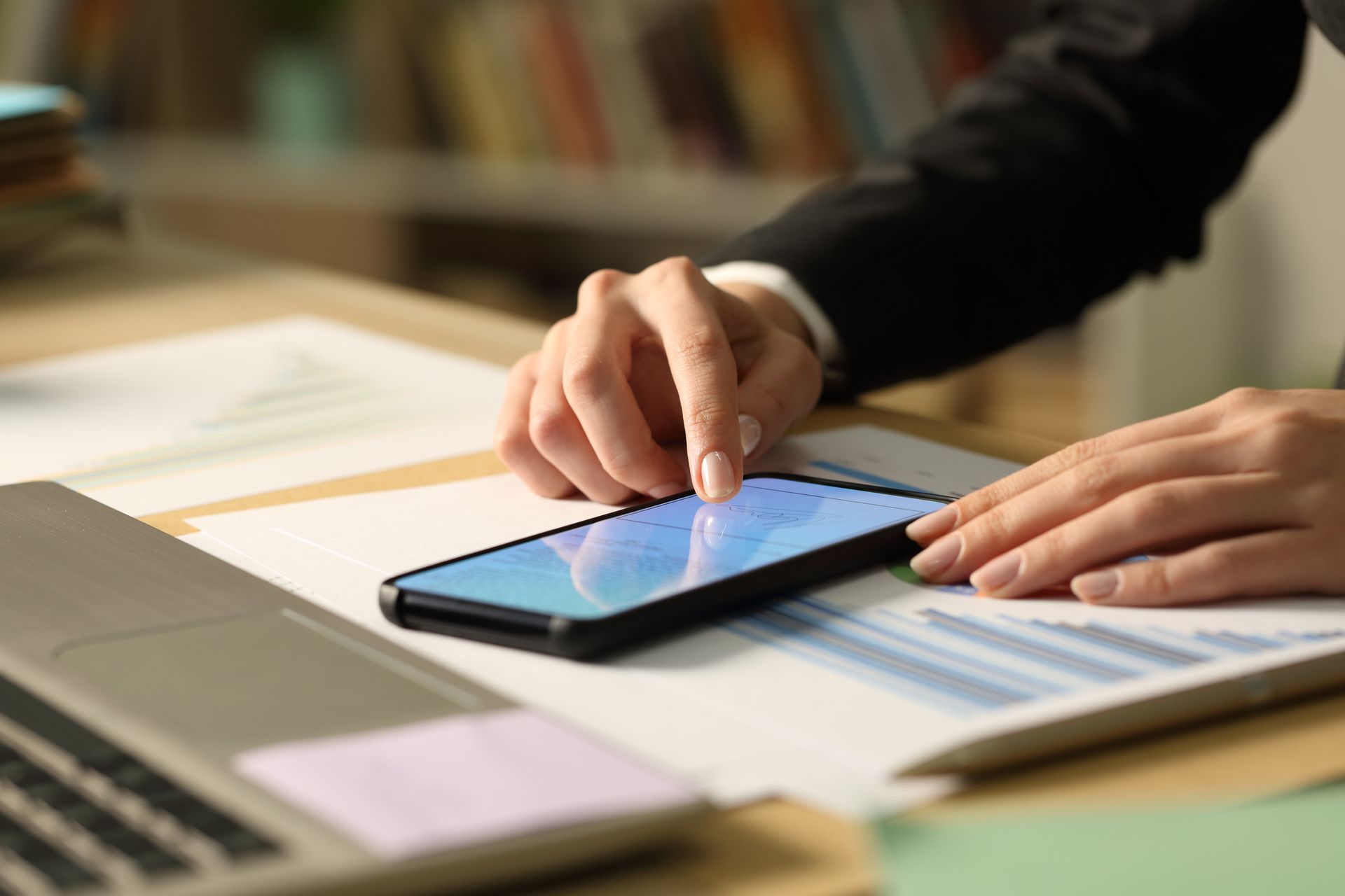 Close up of entrepreneur woman hands signing contract on smart phone with finger. Close up of entrepreneur woman hands signing contract on smart phone with finger.
