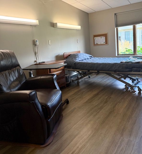 Hospital room with bed and chair