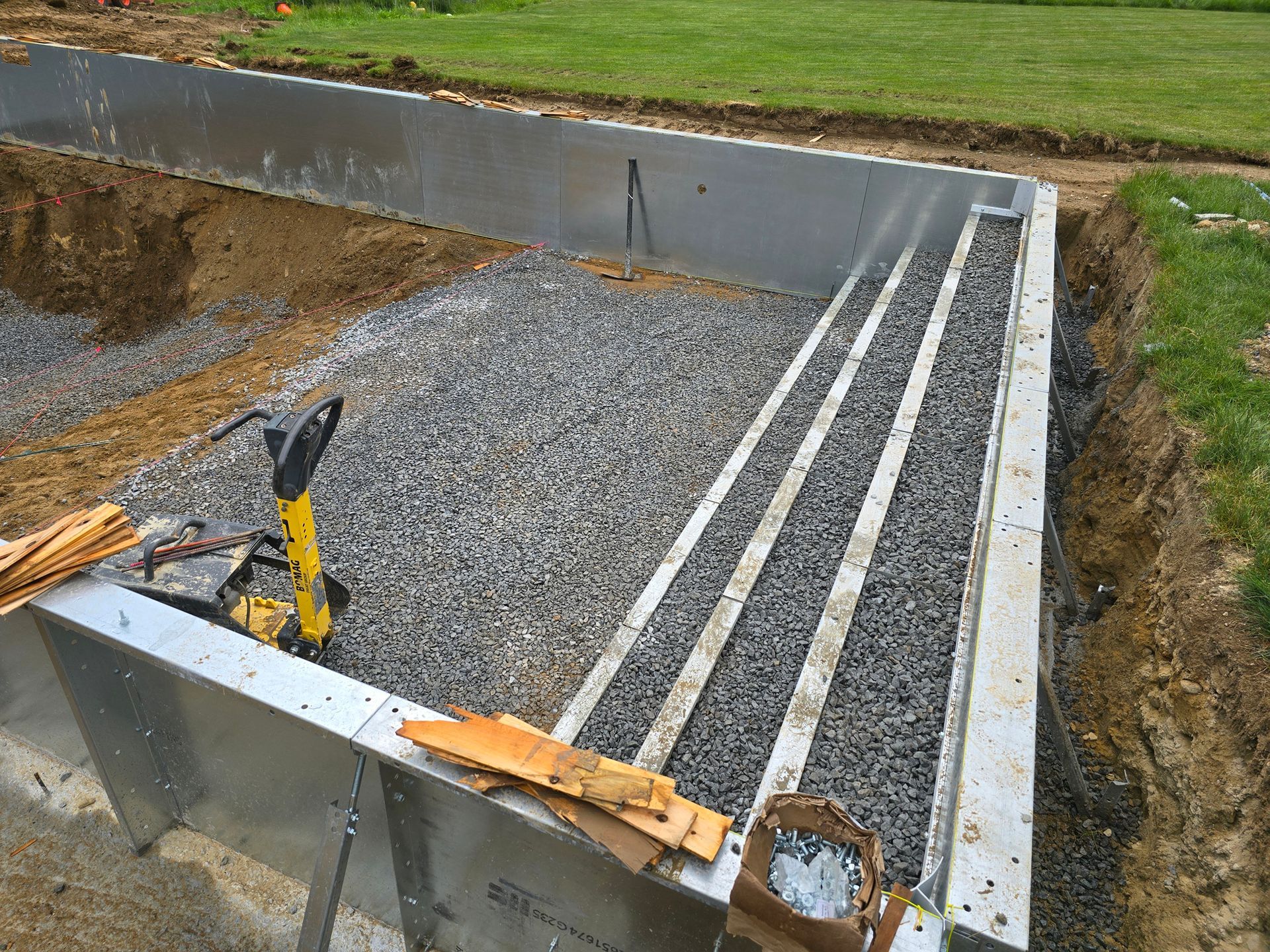 A staircase is being built into a concrete wall.