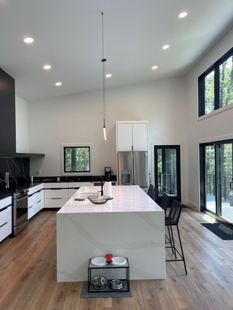 There is a large island in the middle of the kitchen.