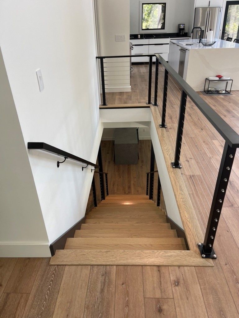 A wooden staircase leading up to the second floor of a house.