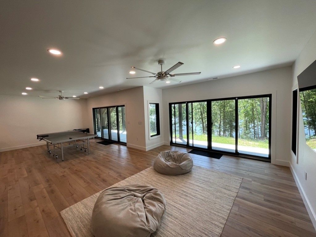 There is a ping pong table in the middle of the room.