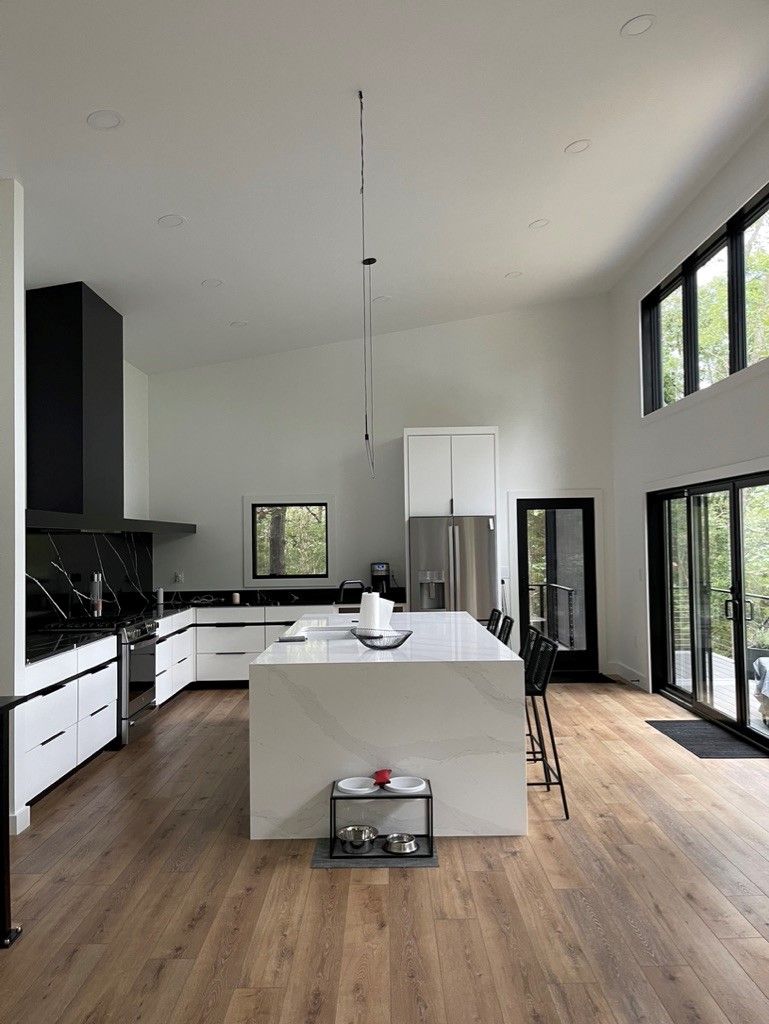 There is a large island in the middle of the kitchen.