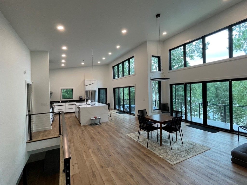 A large room with a table and chairs in it