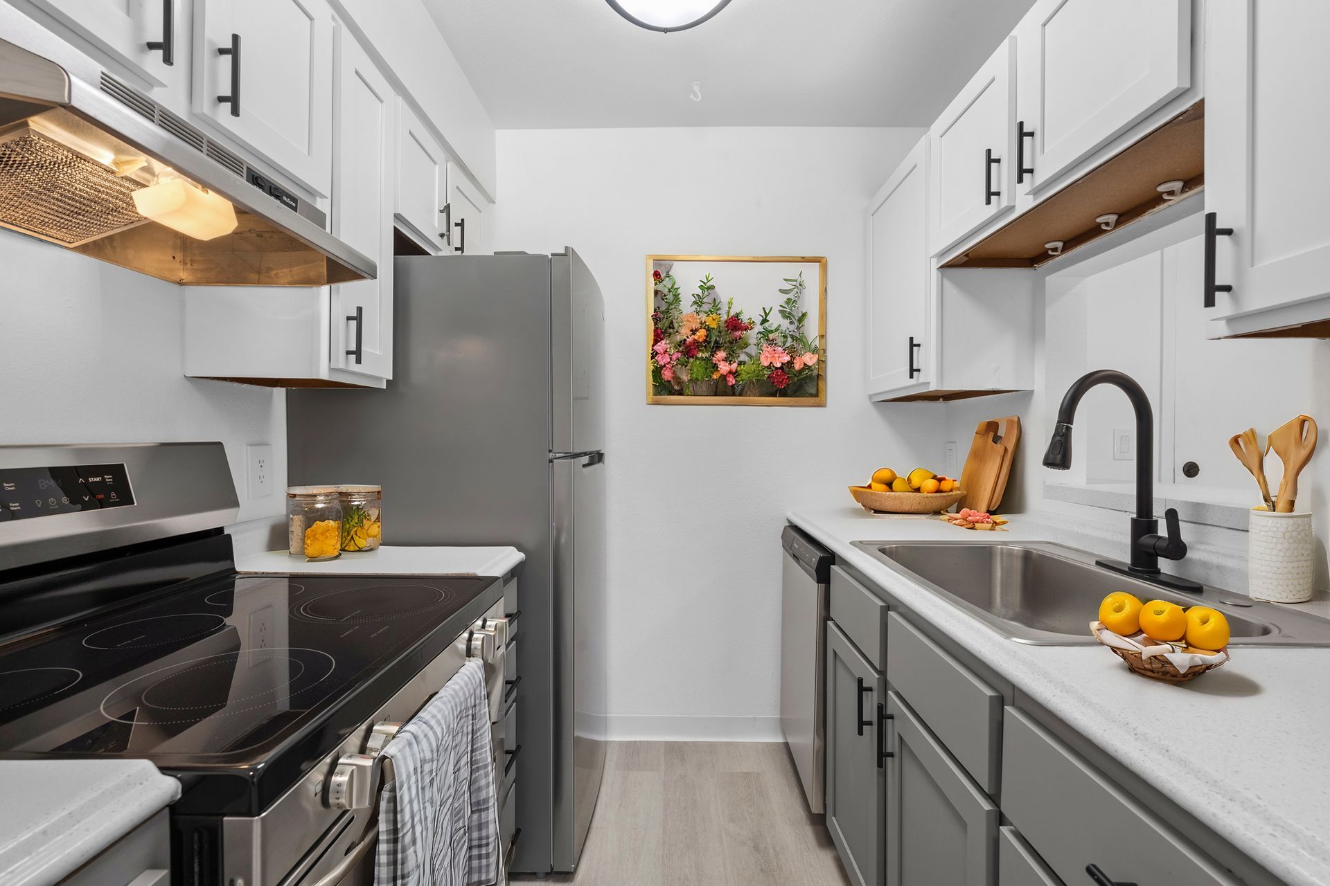 Photo showing a cozy kitchen staged with orange fruits and accessories