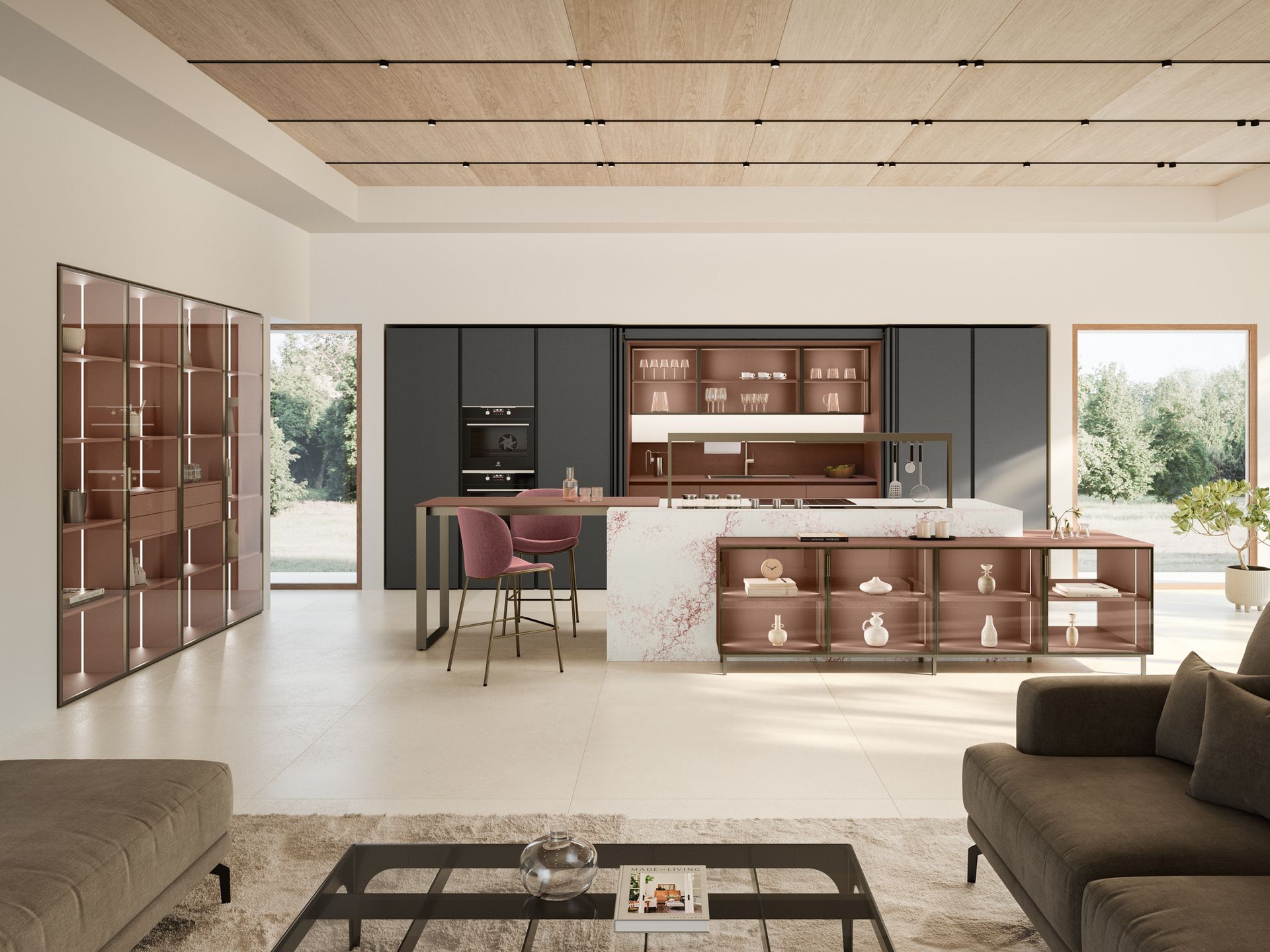 Cucina moderna con isola, mobili e zona salotto; tonalità di marrone e grigio.