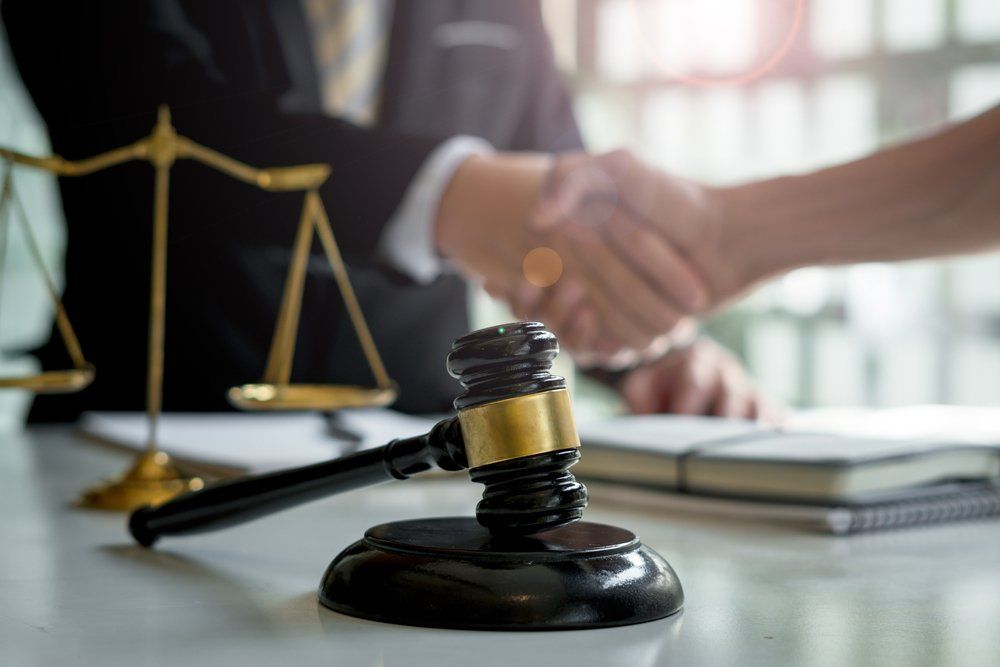 Lawyer Shaking Hands With A Person