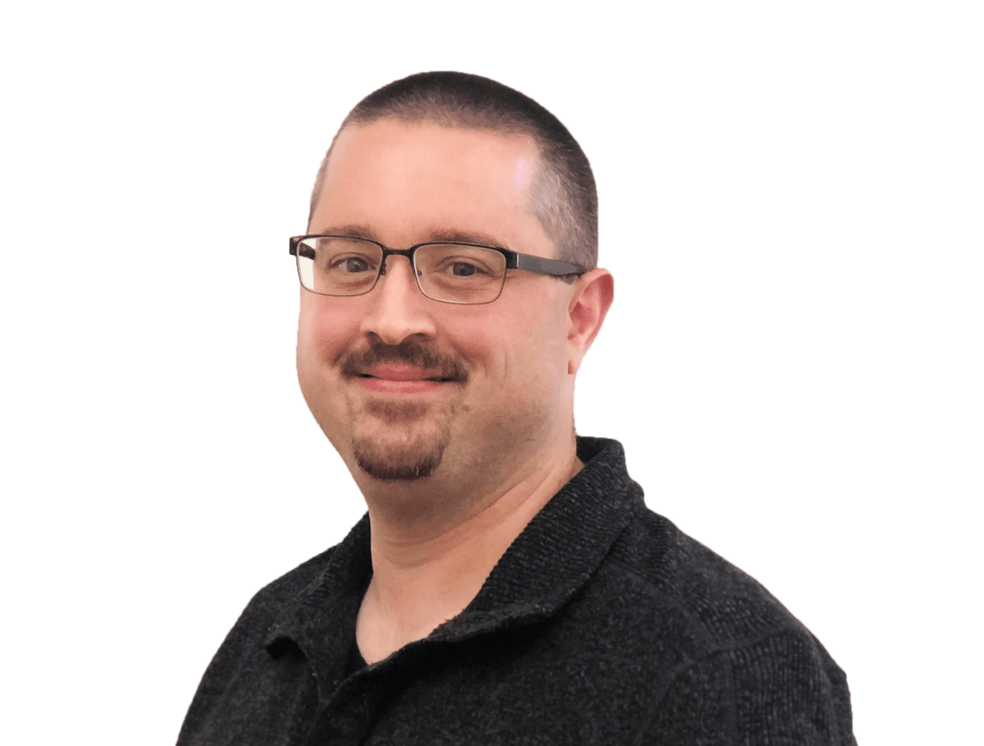 Smiling man with glasses and a short goatee, wearing a dark shirt against a white background