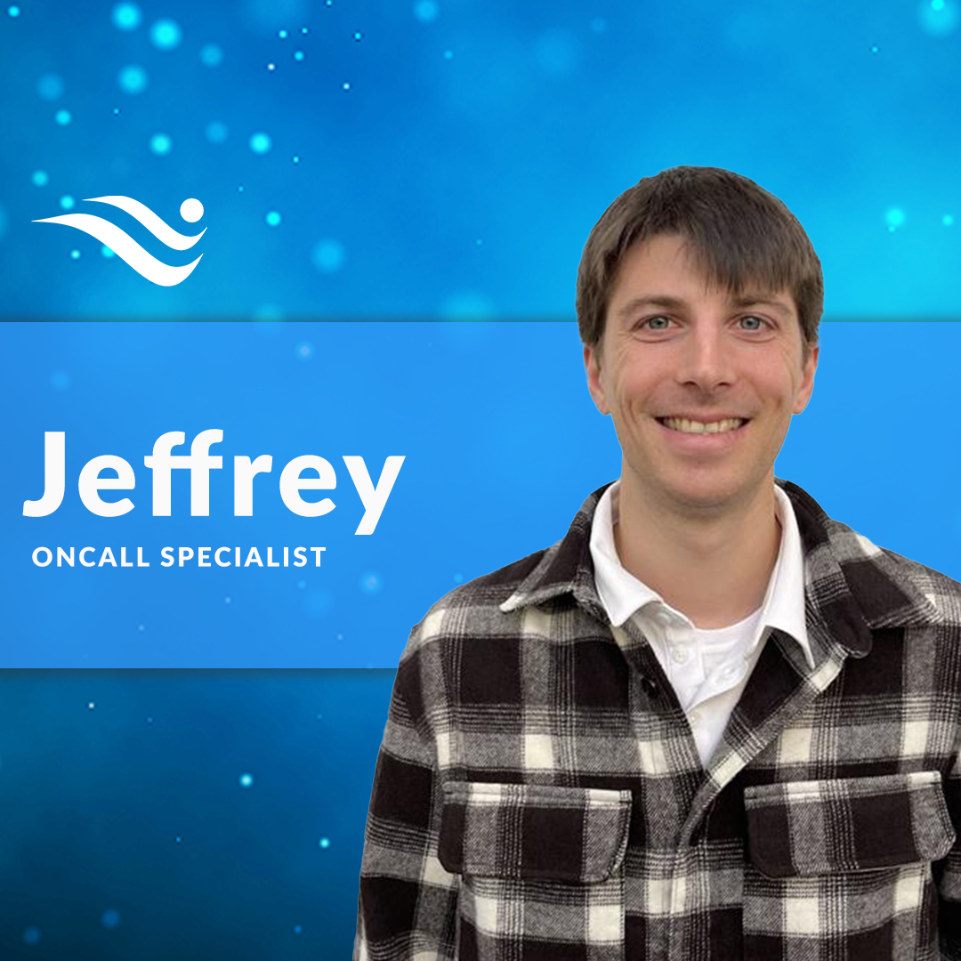 Jeffrey, OnCall Specialist, smiling in a plaid jacket against a blue background