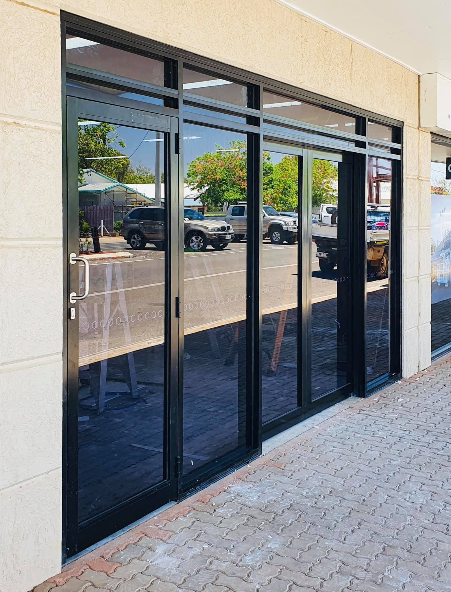 Black-framed Glass Doors of a Store — Innisfail Glass & Aluminium in Innisfail, QLD