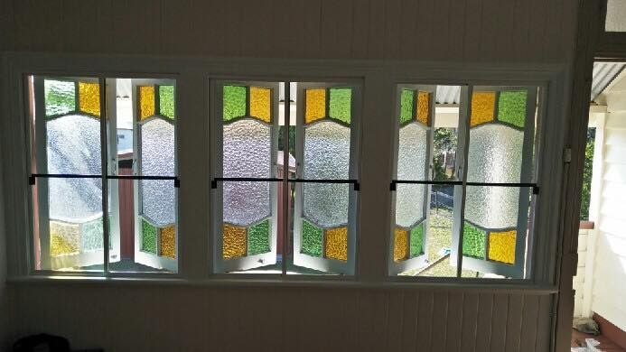 Three-pane Window With Stained Glass Panels in Yellow, Green, and Purple — Innisfail Glass & Aluminium in Innisfail, QLD