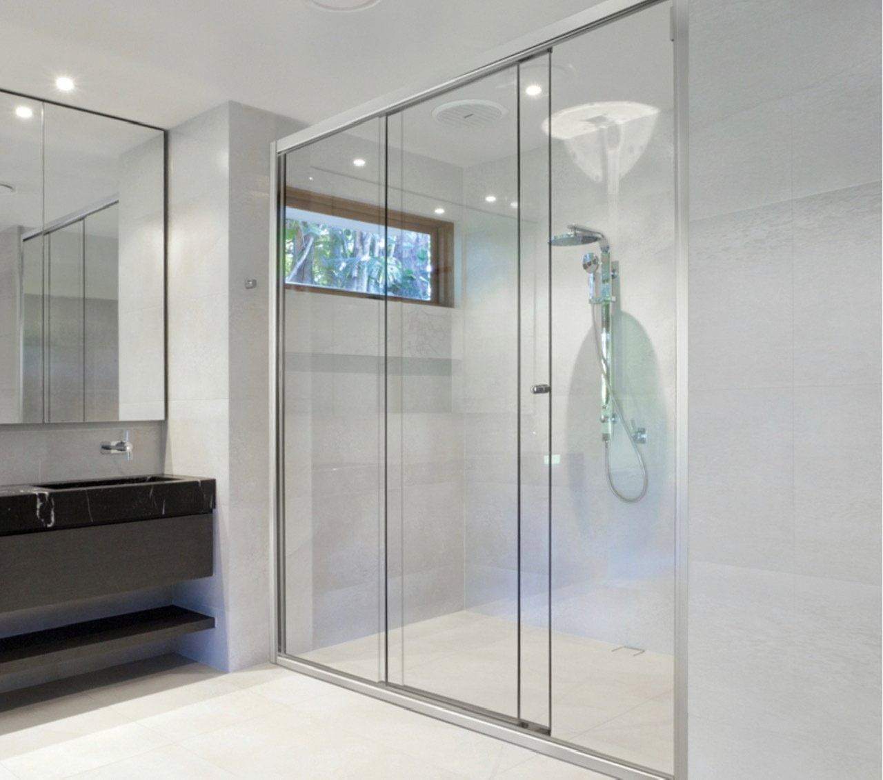 Modern Bathroom With Sliding Glass Shower Doors — Innisfail Glass & Aluminium in Innisfail, QLD