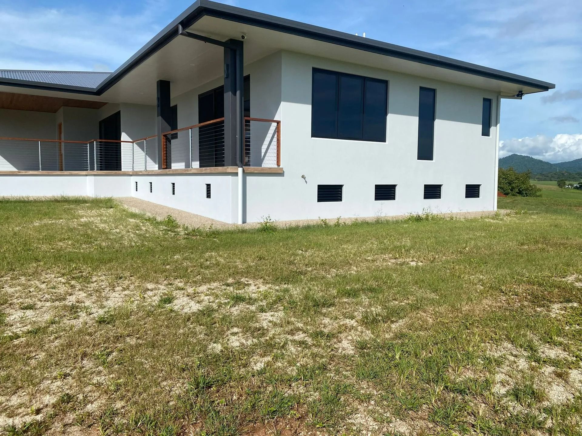 A Modern White House With Black Window Frames — Innisfail Glass & Aluminium in Innisfail, QLD