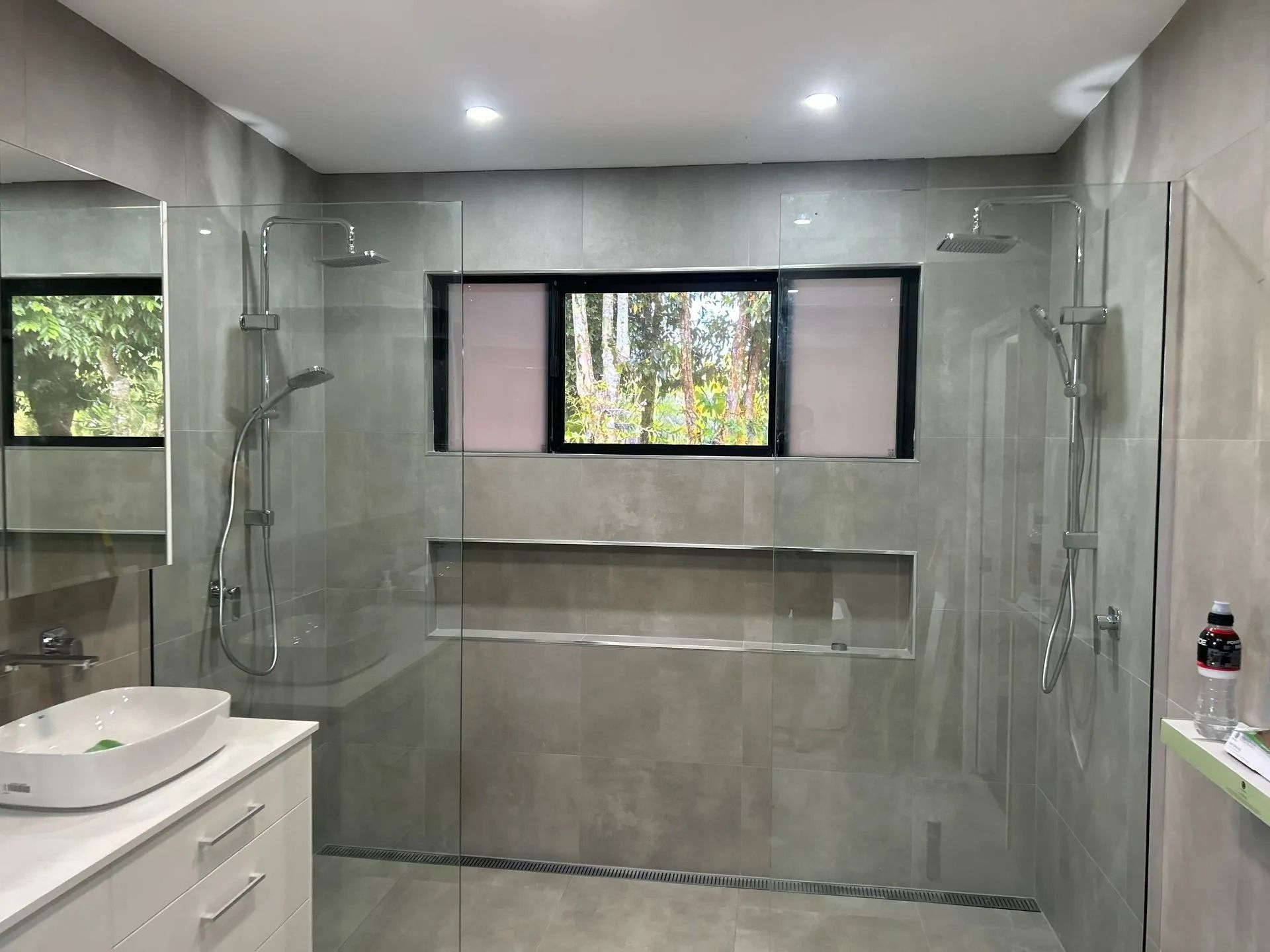 Modern Bathroom With Gray Tiled Walls — Innisfail Glass & Aluminium in Innisfail, QLD