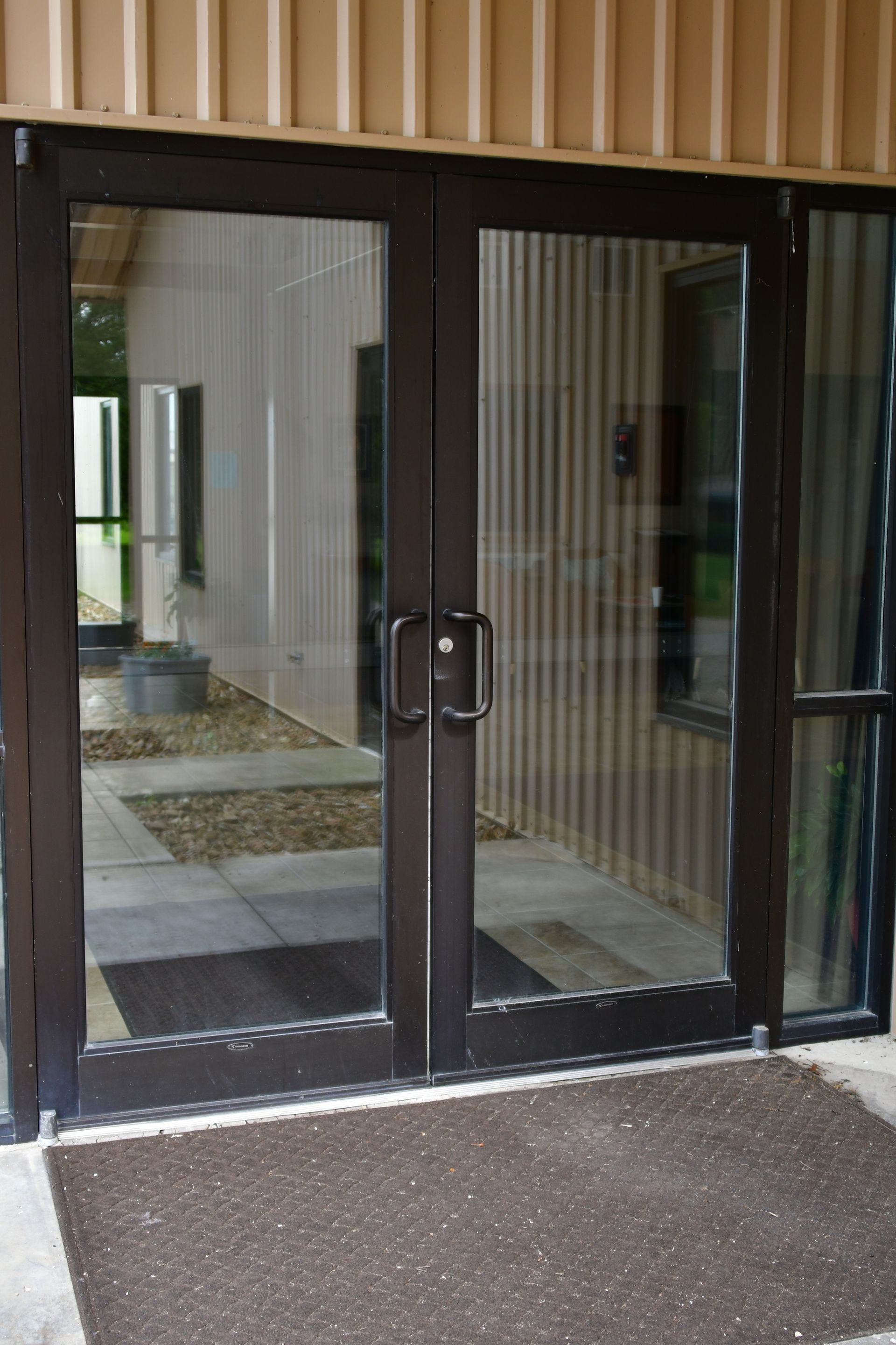 A pair of glass doors leading into a building